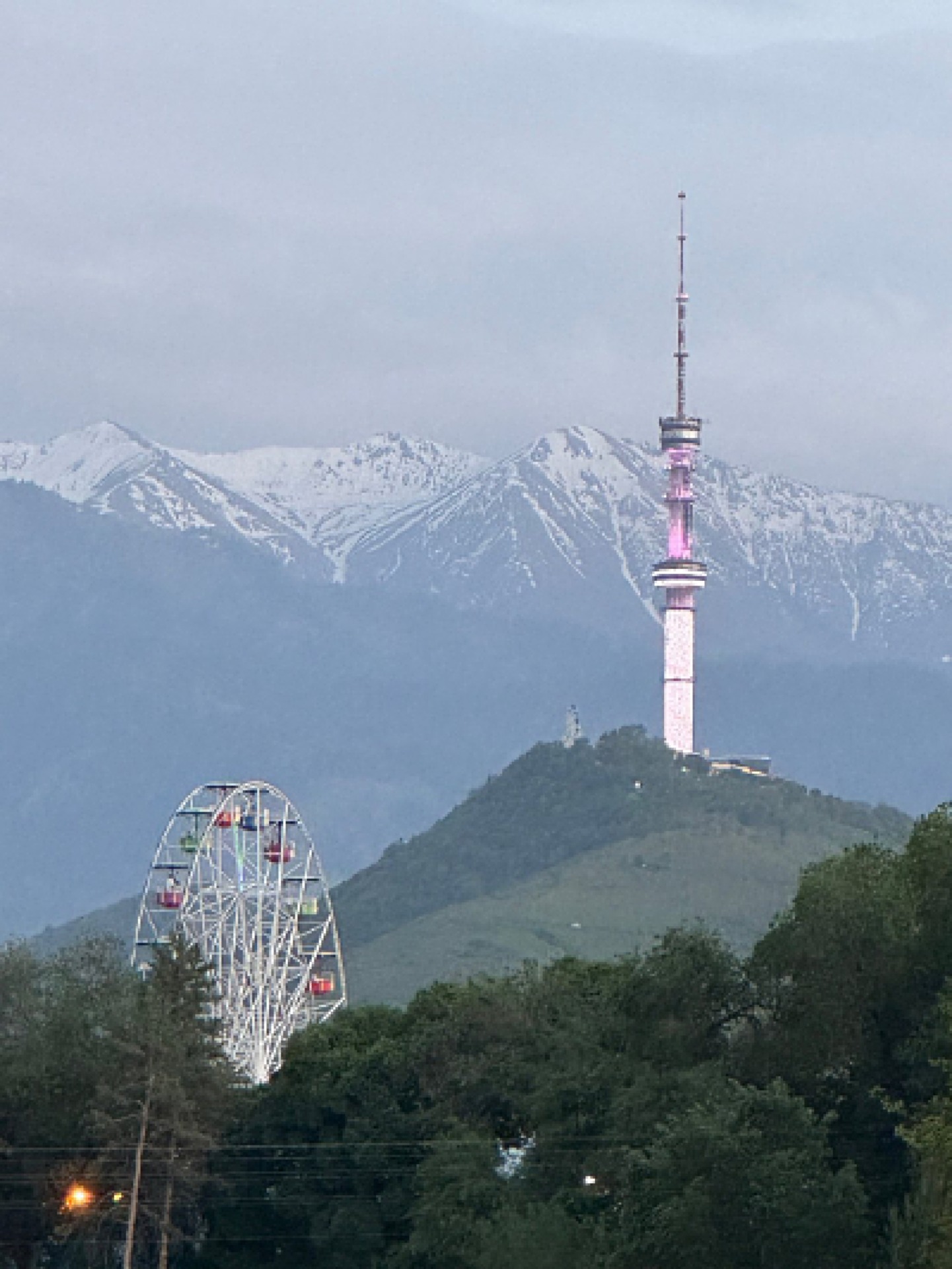TV-tower, ferris weel, mountains