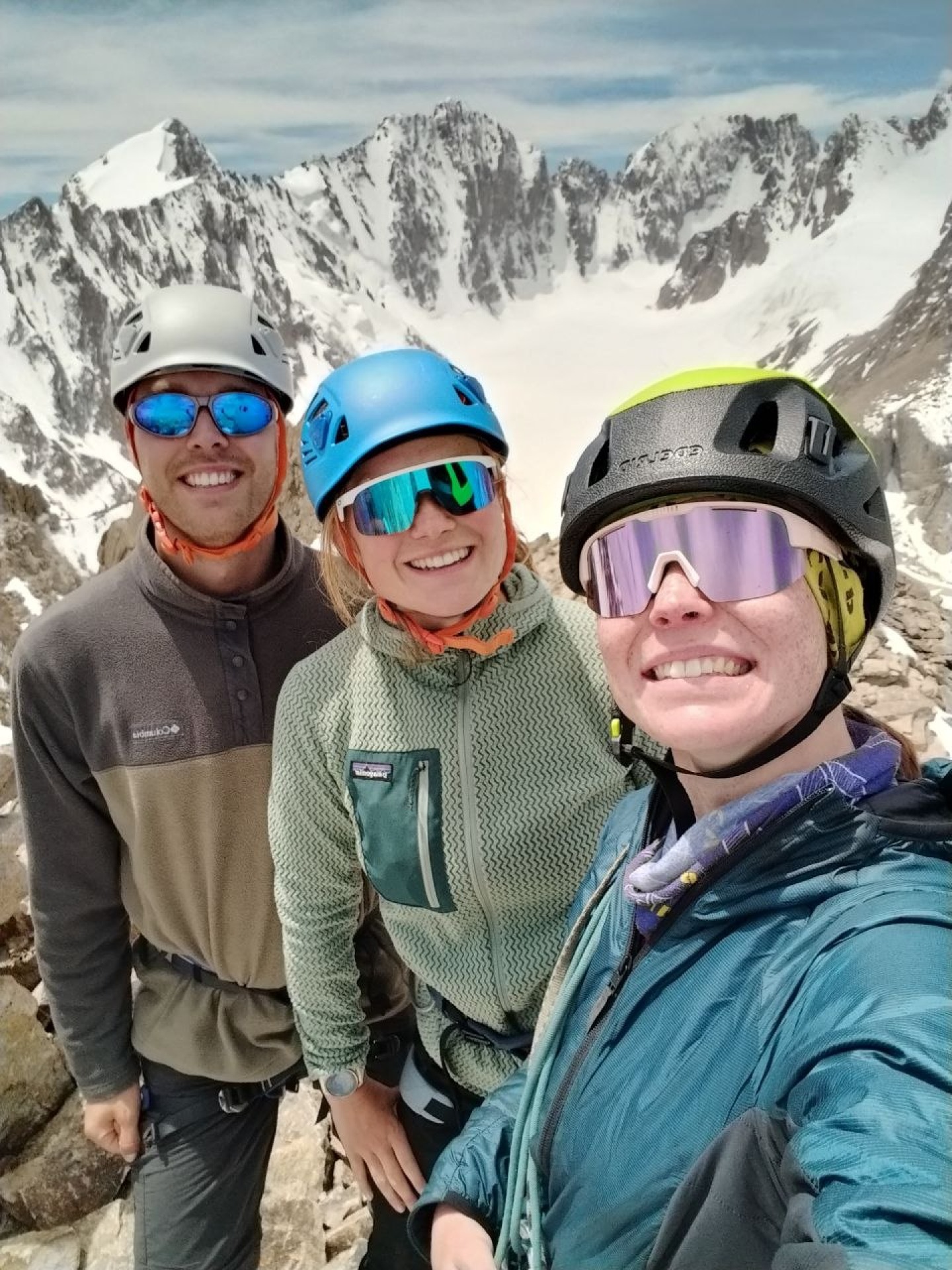 Guide and two clients at the summit of Boks peak