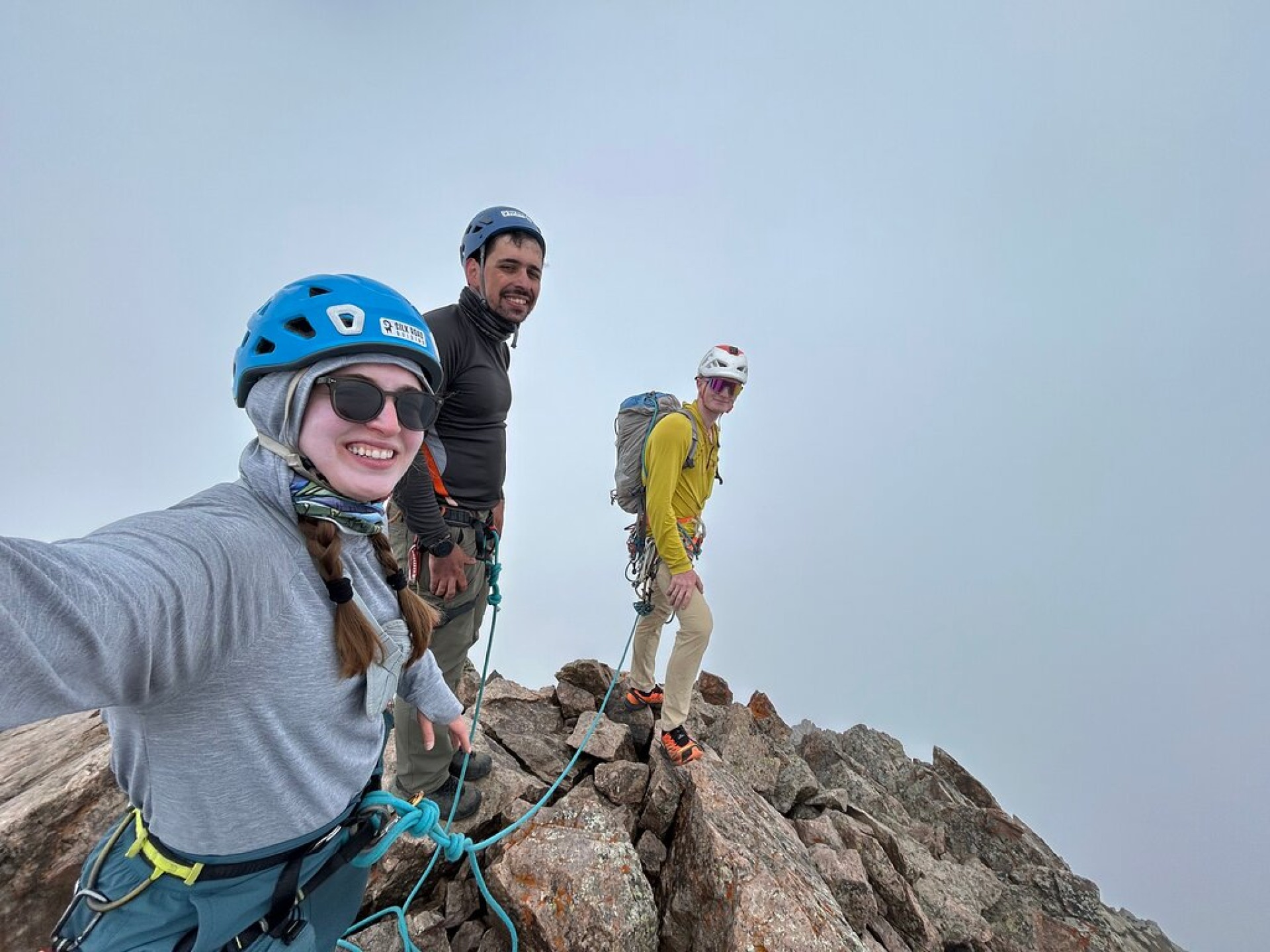 Guide and two clients at the summit of Oktyabryonok peak
