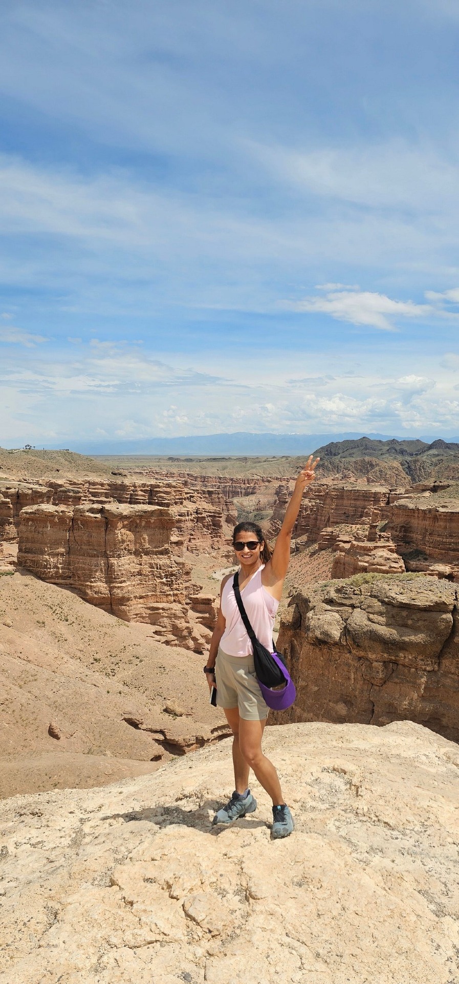 Girl with Charyn Canyon on the background