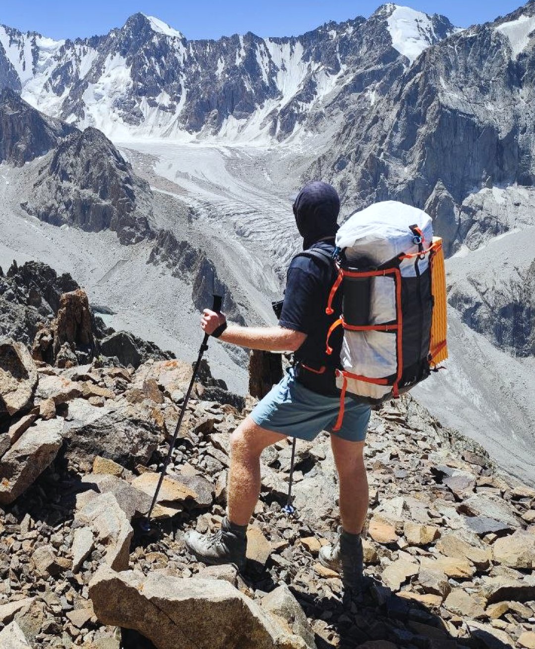 Hiker on his way to the summit of Uchitel peak